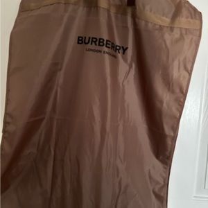 Very stretchy Burberry dress zips up on the back comes to midday closerto knees